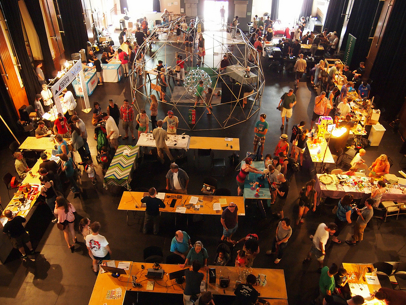 A large room jammed with tables and people